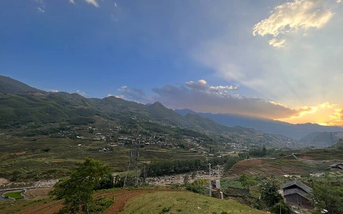 Sapa rice fields and villages at sunset during motorbike tour, Vietnam.