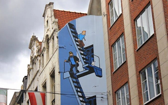 Tintin mural on a building in Brussels, part of the Capital of Comics city exploration game.