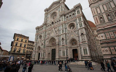Florence Cathedral facade with tourists, part of Haunted Florence exploration game.