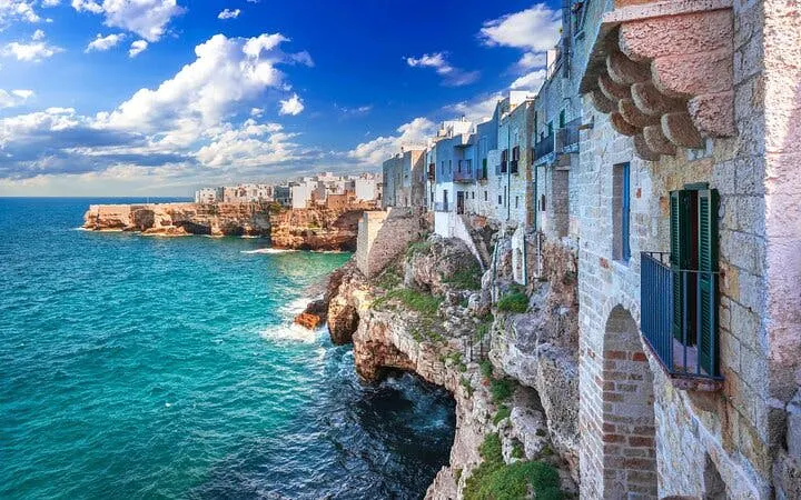 Cliffside view of Polignano a Mare with Adriatic Sea, Valle d'Itria tour from Bari.
