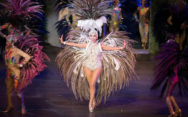 Performer in elaborate costume at Colosseum Show Pattaya, Thailand.