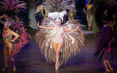 Performer in elaborate costume at Colosseum Show Pattaya, Thailand.