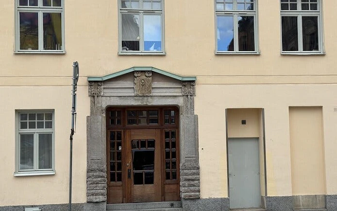 Facade of a historic building in Stockholm featured in The Millennium Trilogy tour.
