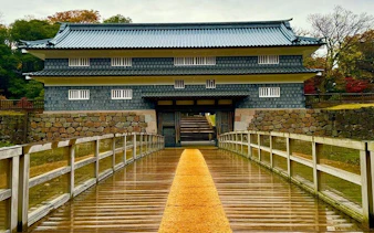 Kanazawa Castle entrance with wooden bridge, Japan.