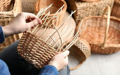 Hands weaving a basket during a handicrafts workshop in Hurghada.