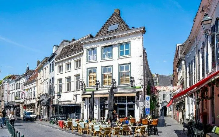 Outdoor café on a historic street in Breda during a self-guided audio walking tour.