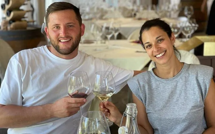 Couple enjoying wine tasting during Tuscany Tuk Tuk tour with local guide.