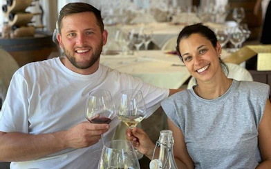Couple enjoying wine tasting during Tuscany Tuk Tuk tour with local guide.