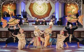 Traditional Lanna dancers perform at Khum Khantoke in Chiang Mai, showcasing cultural costumes and music.