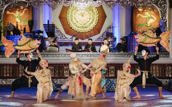 Traditional Lanna dancers perform at Khum Khantoke in Chiang Mai, showcasing cultural costumes and music.