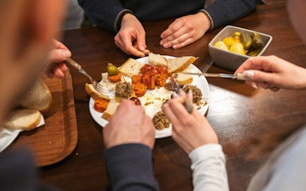 Group enjoying Hungarian appetizers on Budapest food tour.