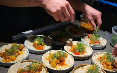 Tacos being prepared with fresh ingredients in Mexico City.