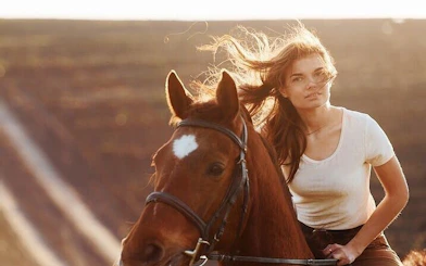 Horseback riding in Hurghada desert with a view of the Red Sea.