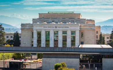 United Nations Office at Geneva building on a sunny day, part of a self-guided walking tour.