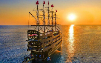 Pirate ship at sunset on Alanya's coast, part of the Last King Alanya Pirate Boat Trip.