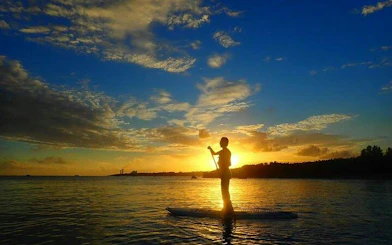 Paddleboarder at sunset on Ishigaki Island, Okinawa.