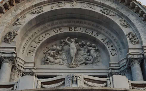 Palacio de Bellas Artes facade with detailed sculptures, Mexico City.