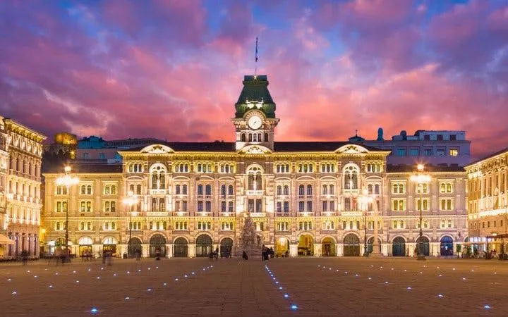 Piazza Unità d'Italia at sunset during Trieste self-guided walking tour.