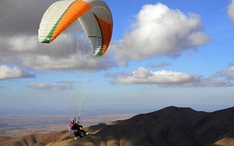Paragliding over Atlas Mountains with view of Lake, Marrakesh.
