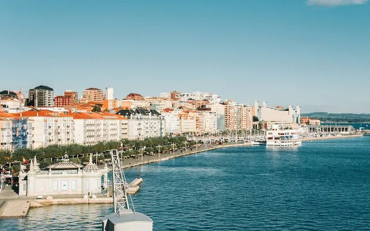 Santander waterfront view with cityscape and harbor, featured in self-guided walking tour app.