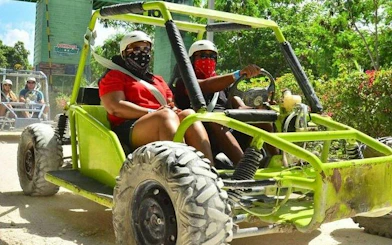 Off-road buggy ride through lush greenery in Punta Cana.