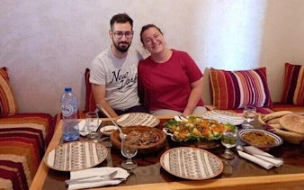 Couple enjoying traditional Moroccan meal during Essaouira city tour cooking class.