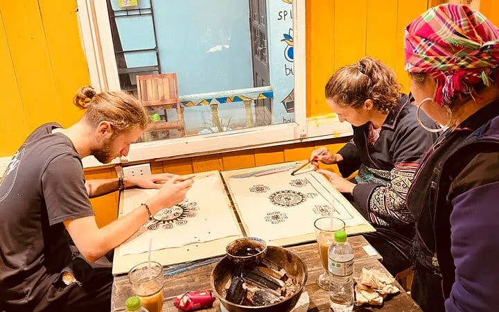 Creating batik art with beeswax at Sa Pa H’Mong workshop, Vietnam.