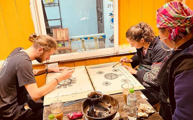 Creating batik art with beeswax at Sa Pa H’Mong workshop, Vietnam.