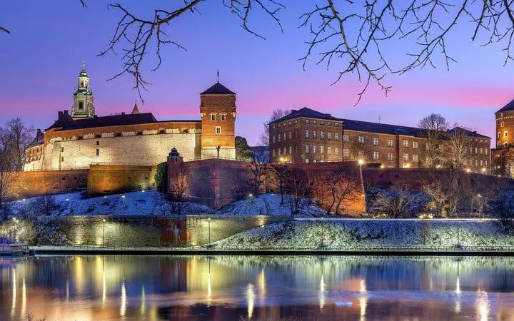 Wawel Castle at dusk reflected in the Vistula River, Krakow Self-Guided Walking Tour.