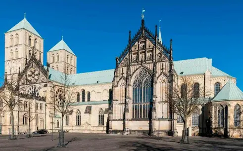 Münster Cathedral exterior on a sunny day, part of self-guided walking tour.