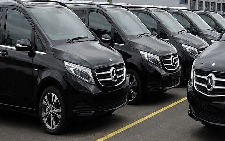 Black Mercedes vans lined up for Antalya Airport private transfer service.