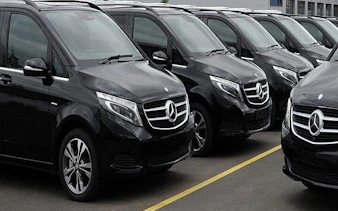 Black Mercedes vans lined up for Antalya Airport private transfer service.