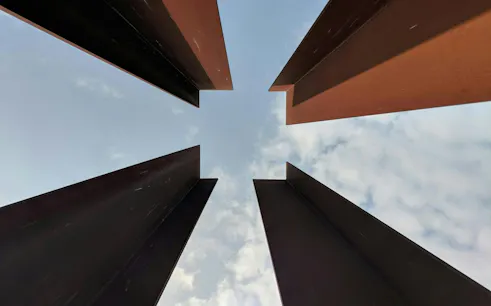 Steel beams at Berlin Wall Memorial against the sky, Bernauer Strasse, Berlin.