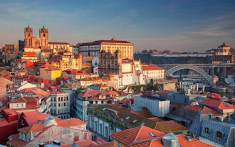 Porto cityscape with historic buildings and Dom Luís I Bridge during a self-guided walking tour.