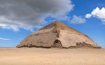 Bent Pyramid at Dahshur under a cloudy sky, part of Saqqara, Memphis, and Dahshur tour.