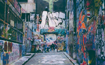 Graffiti-covered alley in Melbourne, part of the Ghosts of Melbourne self-guided city exploration game.