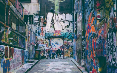 Graffiti-covered alley in Melbourne, part of the Ghosts of Melbourne self-guided city exploration game.