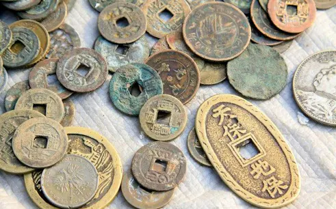 Ancient Japanese coins used in Tokyo coin ring-making workshop in Asakusa.