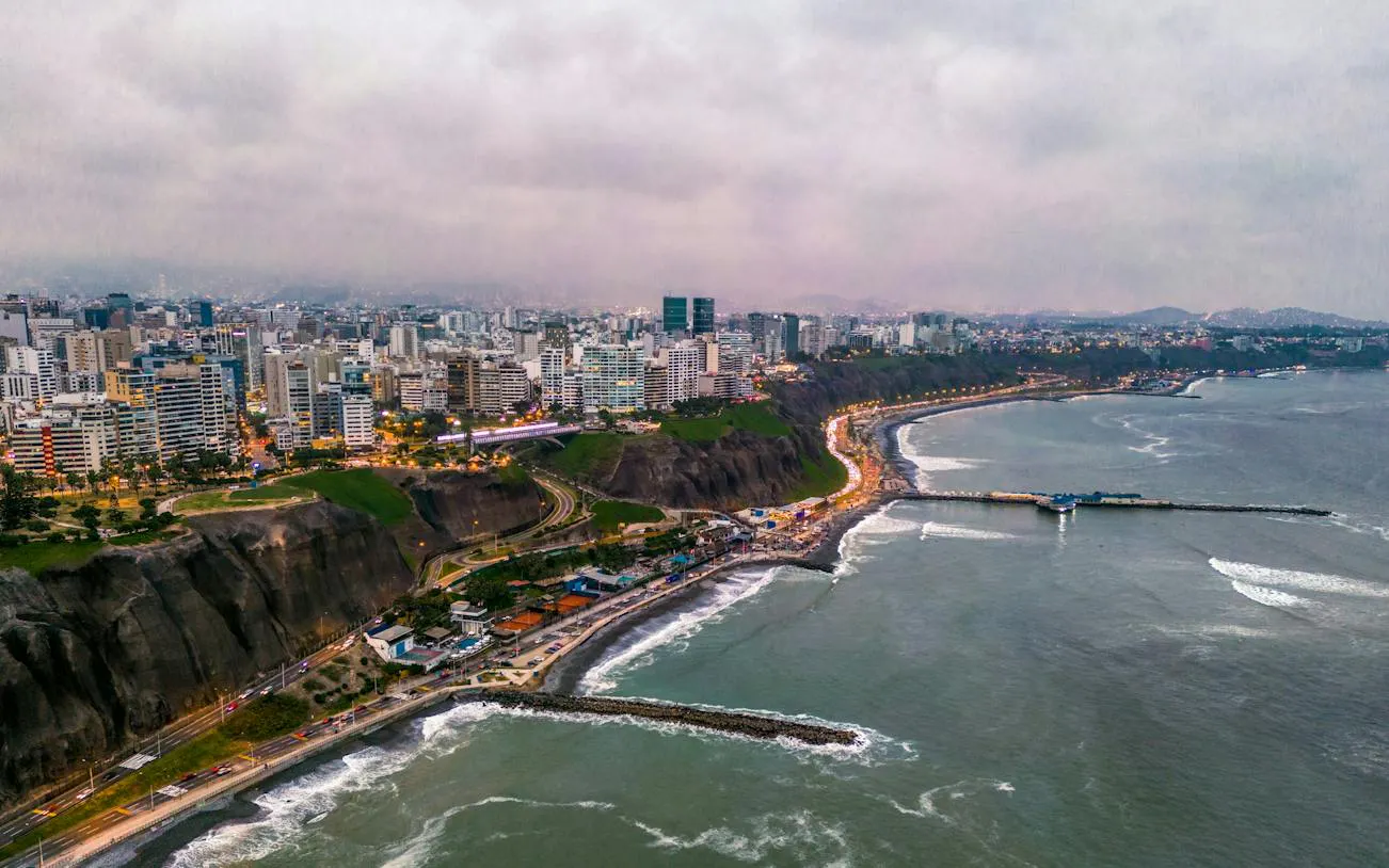 Aerial view of Lima's coastline and cityscape, featuring Barranco district, Peru.