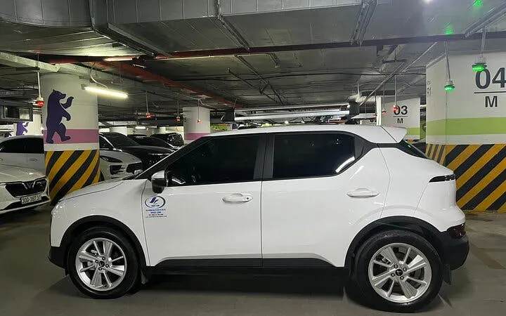 White car in a parking garage for Sapa to Ha Giang City private transfer service.