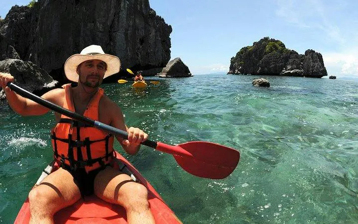 Kayaking through clear waters at Ang Thong National Marine Park, Koh Samui.