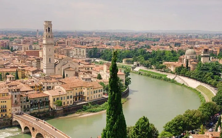 Verona cityscape with Adige River and historic buildings, view from self-guided walking tour.