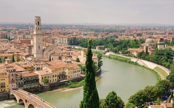 Verona cityscape with Adige River and historic buildings, view from self-guided walking tour.