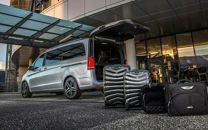 Minivan with open trunk and luggage for private transfer in Marrakesh.