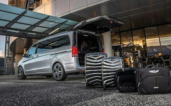 Minivan with open trunk and luggage for private transfer in Marrakesh.