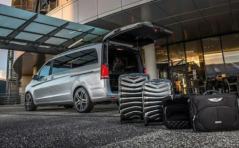 Minivan with open trunk and luggage for private transfer in Marrakesh.