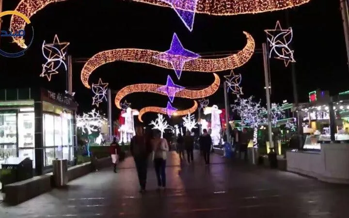 Nighttime street with illuminated decorations in Sharm El Sheikh during a private city tour.