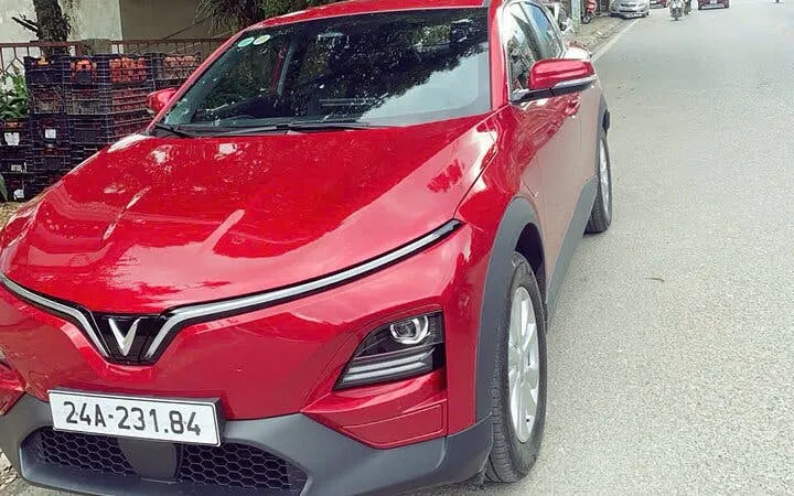 Red car for full-day private rental with driver, flexible itinerary for museum visits.