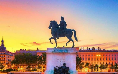 Equestrian statue of Louis XIV at Place Bellecour during sunset, Lyon.