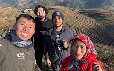 Group enjoying Mu Cang Chai rice terraces during private car tour from Sapa.